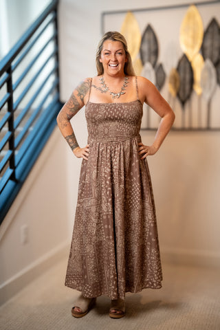 Brown paisley midi dress with smocked bodice and spaghetti straps, flowy skirt