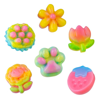 Set of colorful flower-shaped rubber stamps on a white background