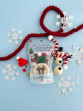 Build a Snowman Mini KidDough Play Pack with white dough, red striped scarf, and accessories