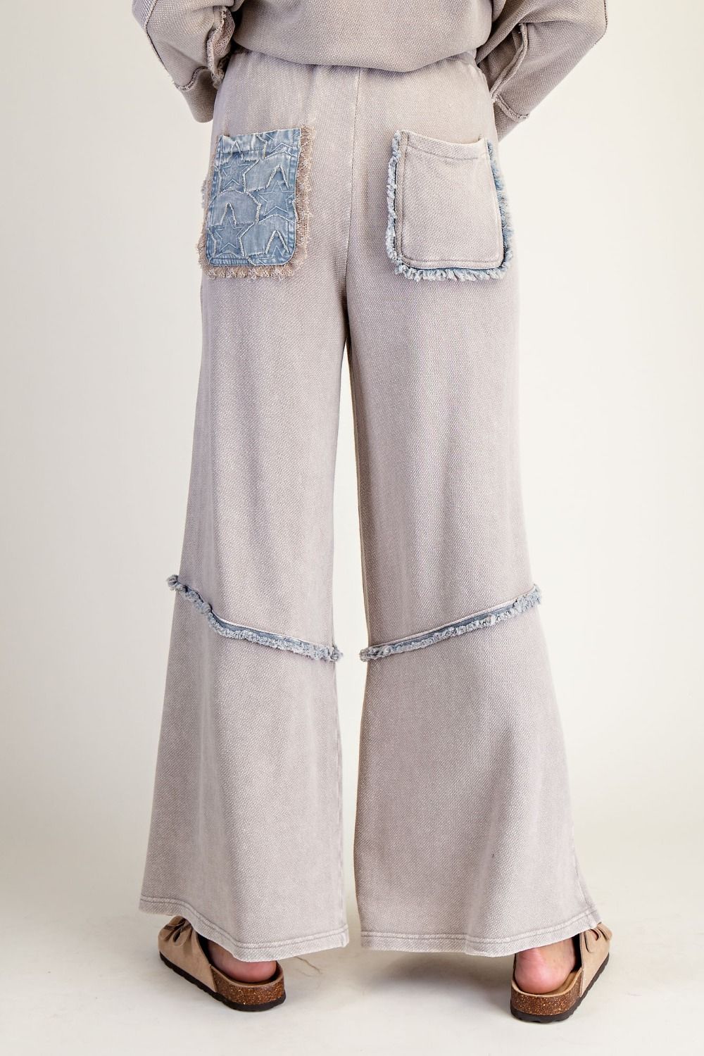 Wide leg pants in light ash with star denim patches and frayed trim