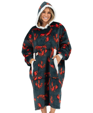 Woman wearing Lazyone Lobster Blanket Hoodie with red lobster print on dark background