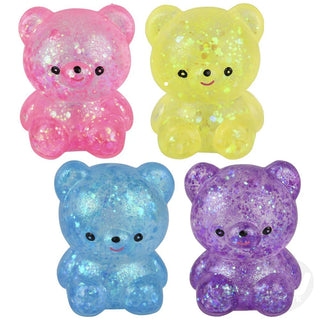 Four glittery bear figurines in pink, yellow, blue, and purple on a white background.