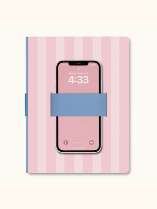 Pink striped notebook with blue elastic phone holder loop and smartphone inserted
