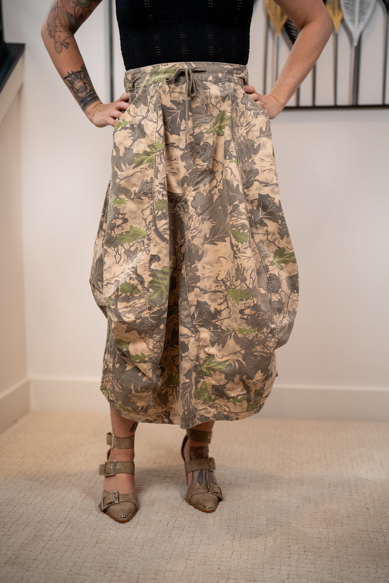 close up detail of the skirt featuring adjustable waistband tie