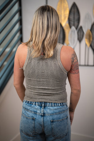 Back view of NikiBiki seamless lace tank top in taupe with racerback style and textured fabric
