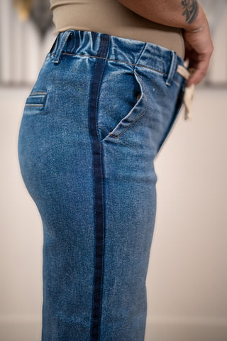 Close up side seam detail of Risen elastic band high rise cropped wide leg jeans