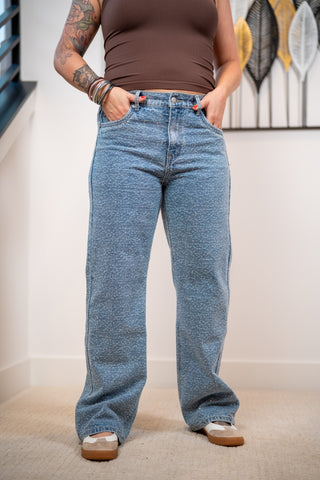 Rhinestone covered denim jeans and brand tank top