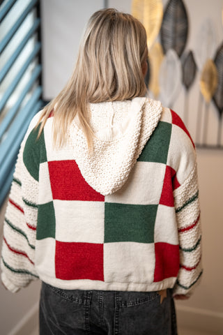 Cream knit hoodie sweater with red and green colorblock checkered pattern