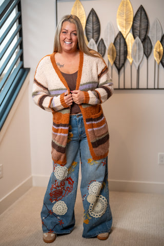 Cream and rust striped open-front knit cardigan with multicolor stripe details