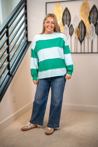 Oversized green and light blue striped long sleeve pullover sweatshirt with crew neck