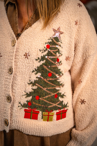 Cream boucle cardigan with embroidered Christmas tree, sequin garland, and gift patches