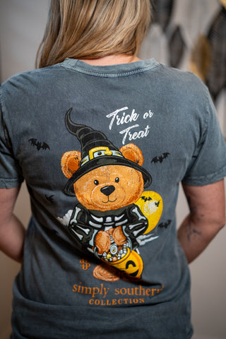 Dark gray Simply Southern tee featuring Halloween teddy bear witch holding pumpkin candy bucket