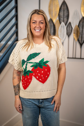 Cream short-sleeve knit sweater with bold red strawberry intarsia pattern by Easel