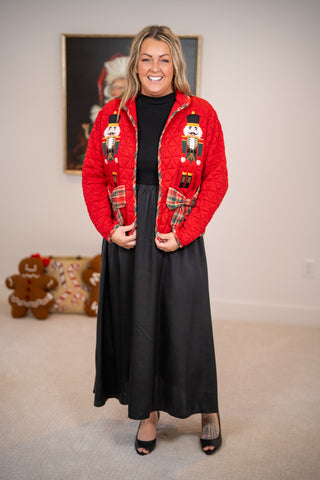 Red quilted nutcracker jacket with plaid trim and bow pockets