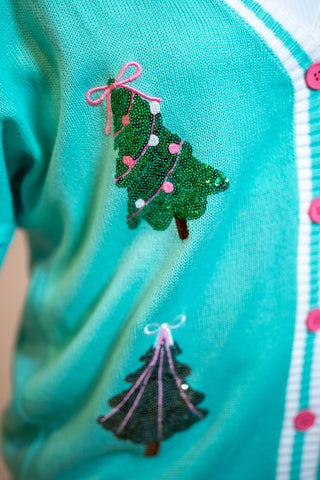 Teal cardigan with sequined Christmas tree embroidery and pink button closure