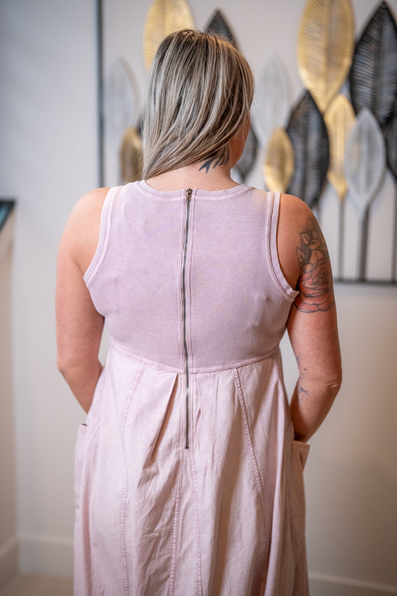 Back view of Easel mauve mineral wash maxi dress with zipper back and cargo pocket design