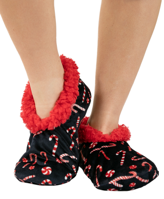Black fuzzy slipper socks with red candy cane print and red sherpa cuff lining