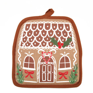 Brown gingerbread house-shaped potholder with white icing, holly, and red bow embroidery
