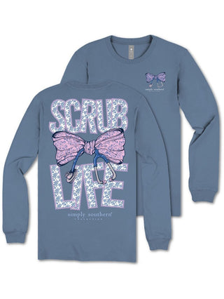 Blue long-sleeve shirt with decorative bow and text on a white background