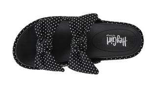 Top view of Corkys Lil Bit Knotty black and white polka dot slide sandals with bow knot straps