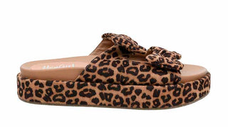 Side view of Corkys Lil Bit Knotty leopard print platform slide sandals with double bow straps