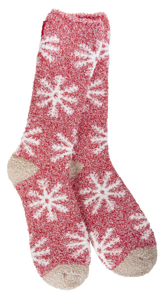 Cozy red fuzzy crew socks with white snowflake pattern and beige heel and toe