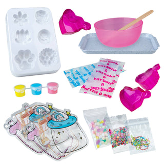 Set of children's play items including a mold, bowls, and packaging on a white background