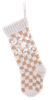 Knit Christmas stocking with beige buffalo check pattern and white snowflake design